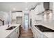 Modern kitchen with white cabinets, island, and stainless steel appliances at 2024 Cedar Falls Dr # 9, Waxhaw, NC 28173