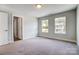 Bright bedroom with neutral walls, carpet flooring, and access to a bathroom at 2024 Cedar Falls Dr # 9, Waxhaw, NC 28173