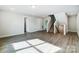 Bright bonus room with hardwood floors and adjacent stairs at 2024 Cedar Falls Dr # 9, Waxhaw, NC 28173