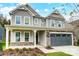 Two-story home with gray siding and stone accents at 2024 Cedar Falls Dr # 9, Waxhaw, NC 28173