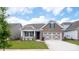 Brick ranch home with 2-car garage and landscaped yard at 9837 Jubilee Ct, Charlotte, NC 28215