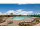 Resort-style pool with lounge chairs and a clubhouse in the background at 9837 Jubilee Ct, Charlotte, NC 28215