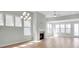 Spacious living room with fireplace and large windows at 9837 Jubilee Ct, Charlotte, NC 28215