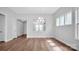 Bright dining room with hardwood floors and kitchen pass-through at 9837 Jubilee Ct, Charlotte, NC 28215