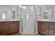 Double vanity bathroom with large walk-in shower at 9837 Jubilee Ct, Charlotte, NC 28215