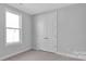 Bright bedroom with double door closet and neutral walls at 9837 Jubilee Ct, Charlotte, NC 28215