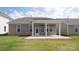 Home features a spacious backyard with a covered patio at 9837 Jubilee Ct, Charlotte, NC 28215