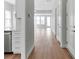 Light hallway with hardwood floors and view to living area at 9837 Jubilee Ct, Charlotte, NC 28215