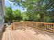 New deck overlooking a private backyard with mature trees at 253 Franklin Nw Ave, Concord, NC 28025