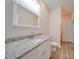 Bathroom with granite countertop vanity and toilet at 253 Franklin Nw Ave, Concord, NC 28025