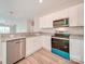 Modern kitchen with white cabinets and granite countertops at 253 Franklin Nw Ave, Concord, NC 28025