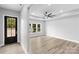 Bright entryway with black front door and gleaming hardwood floors at 913 Wilson Lee Blvd, Statesville, NC 28677