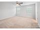 Spacious bedroom with neutral carpeting and ceiling fan at 2011 Sage Park Dr, Charlotte, NC 28217