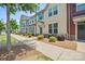 Townhome building showcasing landscaping and street view at 2011 Sage Park Dr, Charlotte, NC 28217