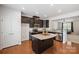 Island kitchen with dark cabinetry and granite countertops at 2011 Sage Park Dr, Charlotte, NC 28217