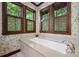 Spa-like bathroom with soaking tub, large windows and designer finishes at 17625 Grasshopper Ln, Charlotte, NC 28278