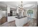 Island kitchen with white cabinets, granite countertops, and breakfast area at 531 Coman Ln, Kings Mountain, NC 28086