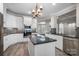 Modern kitchen with white cabinets, granite island, and stainless steel appliances at 531 Coman Ln, Kings Mountain, NC 28086