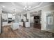 Open kitchen with island, white cabinets, and view into living room at 531 Coman Ln, Kings Mountain, NC 28086