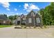 Two-story home with stone and brick exterior, landscaping, and driveway at 531 Coman Ln, Kings Mountain, NC 28086