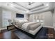 Relaxing main bedroom with a plush bed, neutral color palette, and hardwood floors at 531 Coman Ln, Kings Mountain, NC 28086