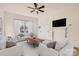 Bright living room with hardwood floors, fireplace, and ceiling fan at 1228 N Main St, Salisbury, NC 28144
