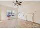 Bright living room with hardwood floors, fireplace, and ceiling fan at 1228 N Main St, Salisbury, NC 28144