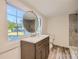 Modern bathroom with walk-in shower, vanity, and large mirror at 1228 N Main St, Salisbury, NC 28144