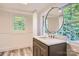 Modern bathroom with walk-in shower, vanity, and large mirror at 1228 N Main St, Salisbury, NC 28144