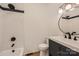 Clean bathroom with a white vanity and black accents at 1228 N Main St, Salisbury, NC 28144