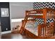 Cozy bedroom with a bunk bed and chevron patterned wall at 16339 Stinson Cove Rd, Huntersville, NC 28078