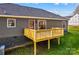 Rear view of house, showcasing deck and yard at 746 Whites Farm Rd, Statesville, NC 28625