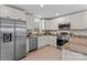 Modern kitchen with white cabinets and granite counters at 746 Whites Farm Rd, Statesville, NC 28625