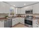 Modern kitchen with white cabinets and granite counters at 746 Whites Farm Rd, Statesville, NC 28625