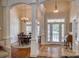 Two-story entryway with hardwood floors and elegant columns at 3670 West Bay Dr, Sherrills Ford, NC 28673