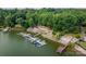 Aerial view of lakefront property with boat slips and lush landscaping at 3670 West Bay Dr, Sherrills Ford, NC 28673