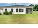 House with screened porch and grassy backyard at 3005 Striped Maple Ct, Charlotte, NC 28215