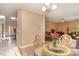 Dining area with glass-top table and four chairs, view of living room at 2922 Island Point Dr, Concord, NC 28027