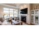 Cozy living room features a fireplace, built-ins, and large windows at 132 Alenda Lux Cir # 7, Mooresville, NC 28115