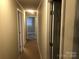 Clean hallway with doors to bedrooms and other rooms at 701 Shannon Bradley Rd, Gastonia, NC 28052