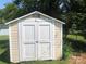 White storage shed with double doors at 701 Shannon Bradley Rd, Gastonia, NC 28052