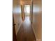 Long hallway with wood-look laminate flooring at 1089 Cedar Springs Rd, York, SC 29745