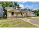 Nice yellow house with a front porch and brick accents at 430 Dave Lyle Blvd, Rock Hill, SC 29730