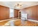 Living room with hardwood floors, fireplace, and built-in shelving at 430 Dave Lyle Blvd, Rock Hill, SC 29730