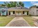 Charming yellow house with a front porch and brick columns at 430 Dave Lyle Blvd, Rock Hill, SC 29730