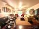 Spacious living room with ample seating and hardwood floors at 5419 Stevens Mill Rd, Matthews, NC 28104