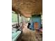 Relaxing screened porch with wooden floors and outdoor furniture at 5419 Stevens Mill Rd, Matthews, NC 28104