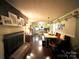 Kitchen features a brick fireplace, table, and ample counter space at 5419 Stevens Mill Rd, Matthews, NC 28104
