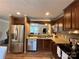 Modern kitchen with stainless steel appliances and wood cabinets at 5401 Stevens Mill Rd, Matthews, NC 28104