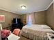 Bright bedroom with a comfy bed and plenty of natural light at 5401 Stevens Mill Rd, Matthews, NC 28104